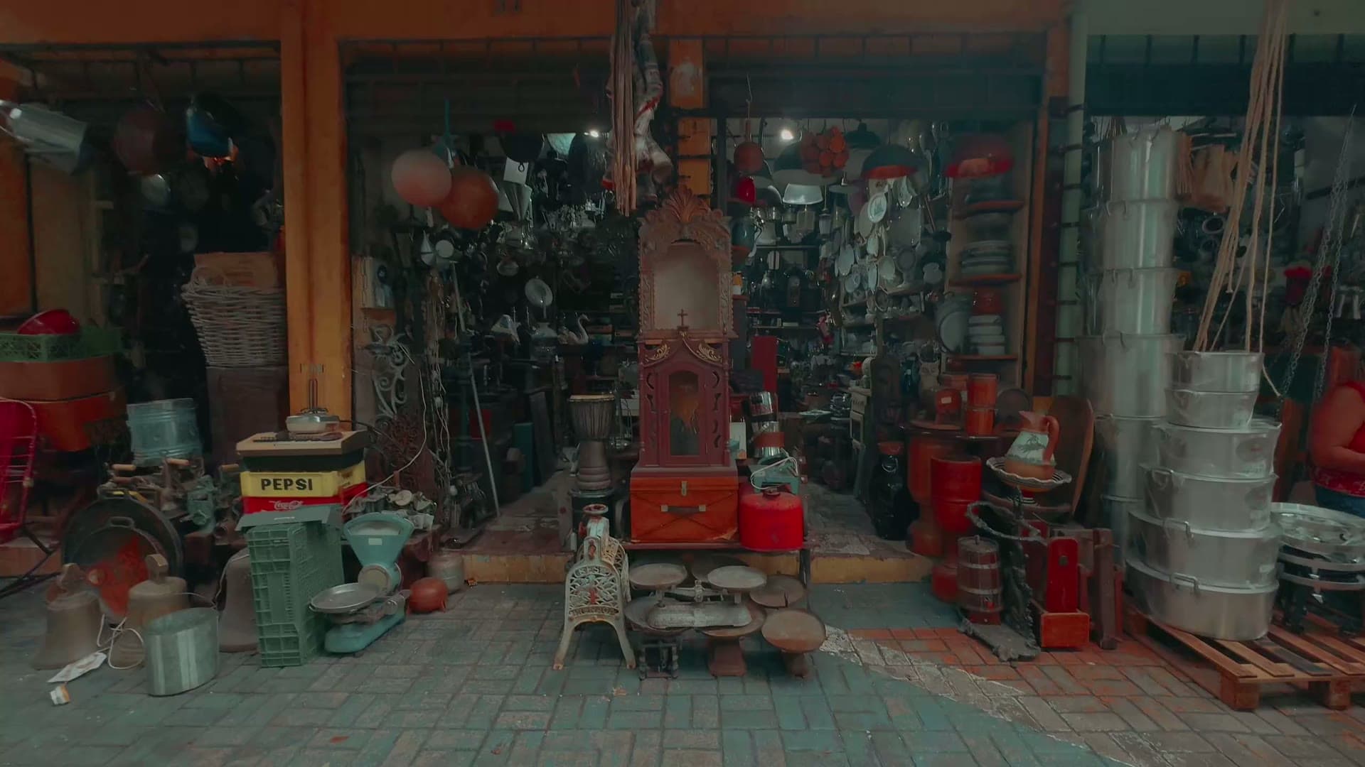 Shelves and cases packed with antiques and collectibles inside Star Center Antique Mall